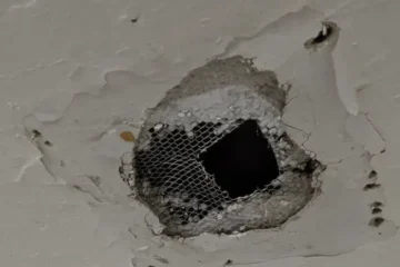 A hole in the ceiling of one resident's unit at the Fellsway West building.