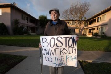 Jorge Lopez, father of Jose Lopez, holding a sign amidst apartment negotiations. (COURTESY OF JOSE LOPEZ)