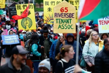 Over 100 people march for affordable housing and rent control in front of Boston City Hall in May. Danielle Parhizkaran / The Boston Globe
